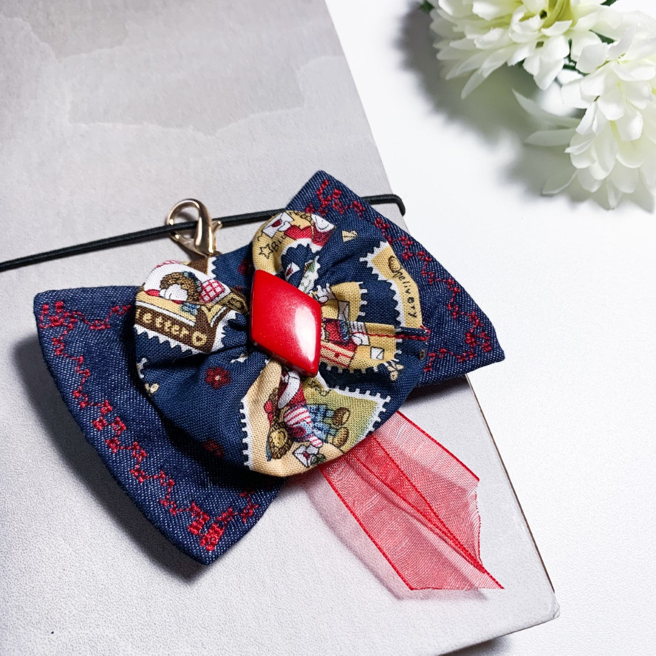 Denim charm with red