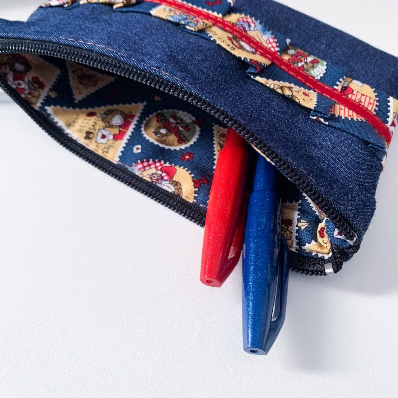 Denim and stamp pattern pouch