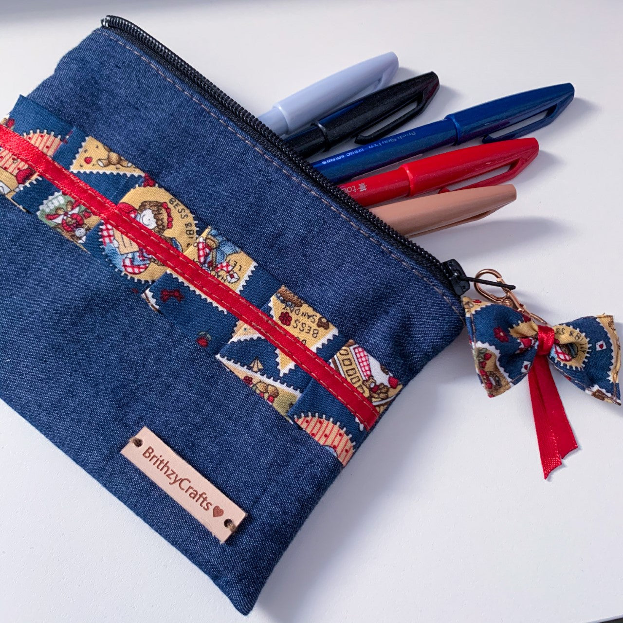 Denim and stamp pattern pouch